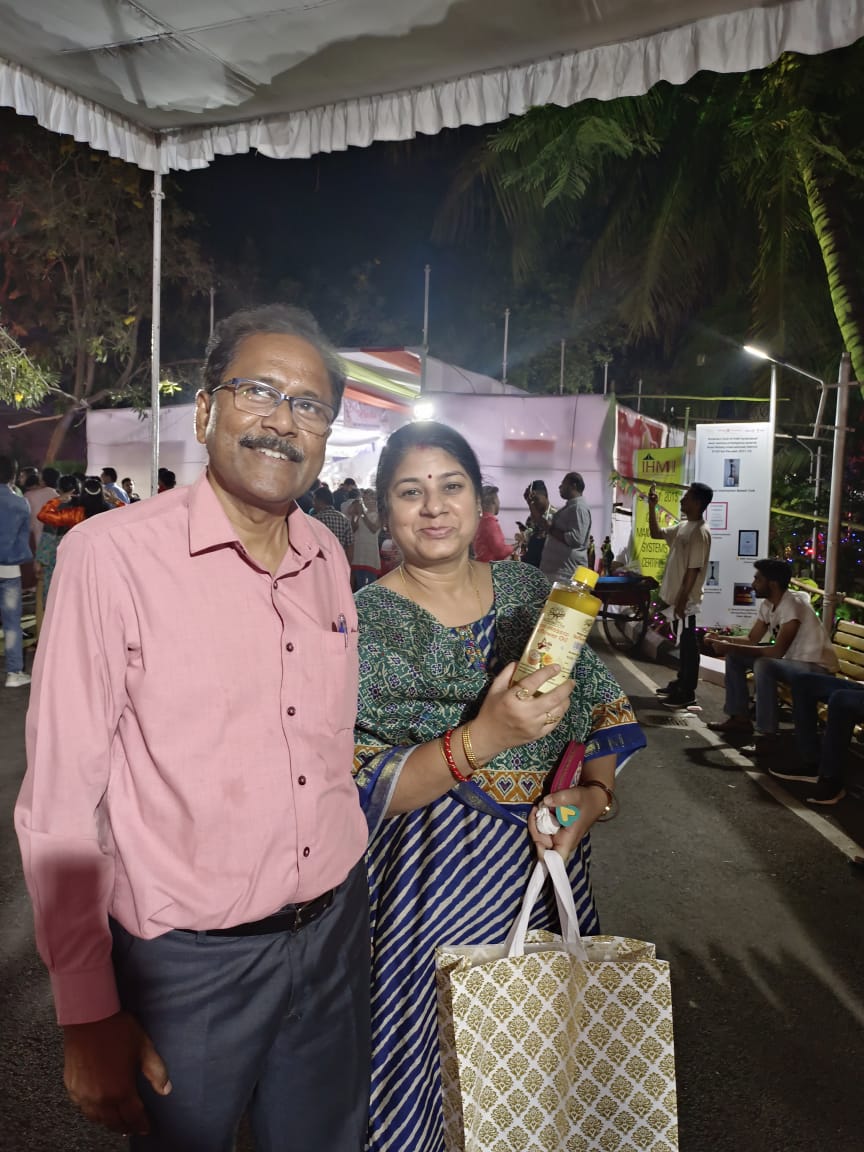 Guests with a Rushikulya bottle and gift pack — Community fair, Hyderabad