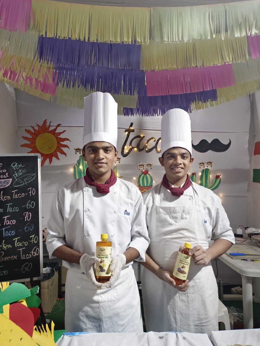 Wood Pressed Mustard and Flaxseed oils on display — Festival food stall